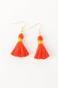 THE JULIA 1-1/4” deep orange tassel earrings